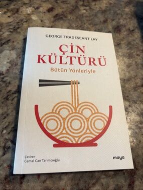 Maya White Cover Book with Red and Orange Bowl Graphic